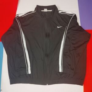 The Mens Black Nike Jacket is a stylish and functional windbreaker designed for